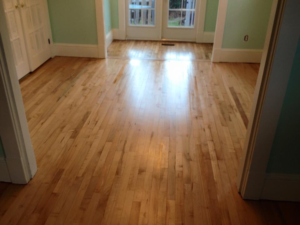 The hardwood floor was completely sanded and refinished with a gorgeous satin finish